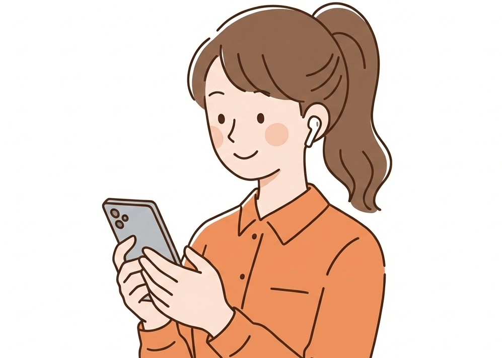 イヤフォンでスマホからの音を聞いている女性